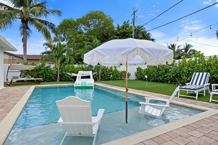 Heated saltwater pool with sun shelf.