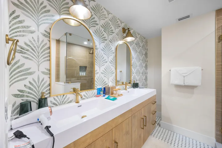 Dual vanity. Toilet with heated seat and bidet.