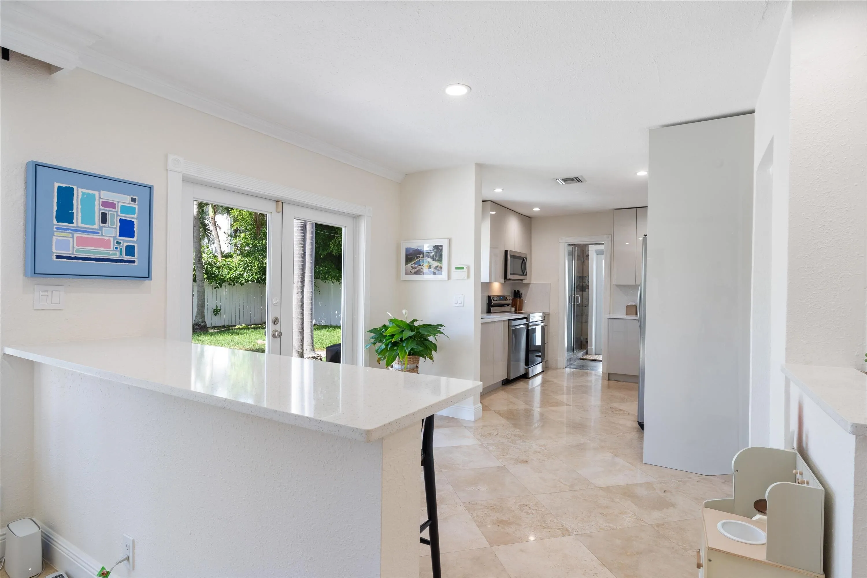 Renovated kitchen with stainless appliances