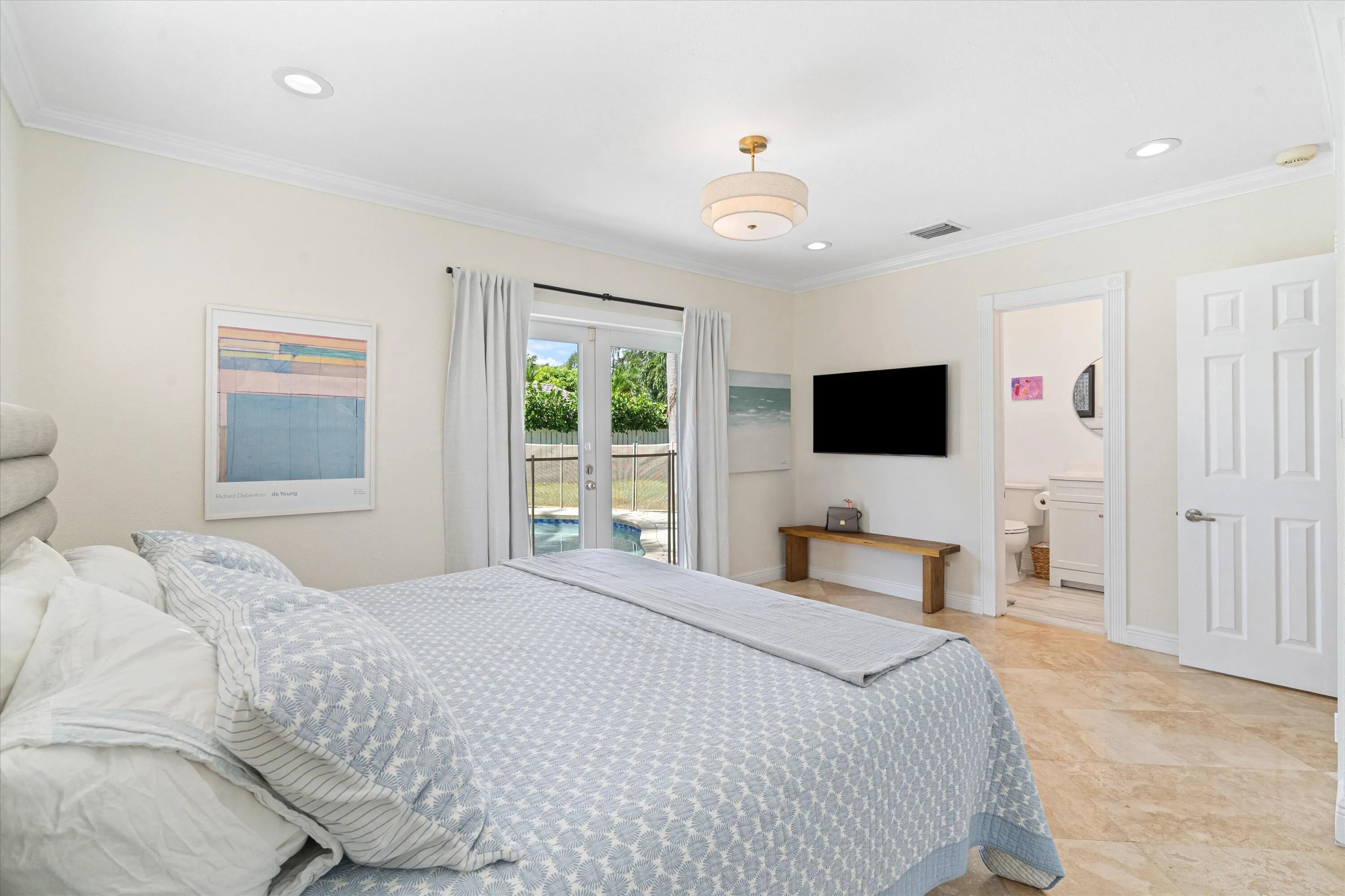 Primary bedroom with pool view