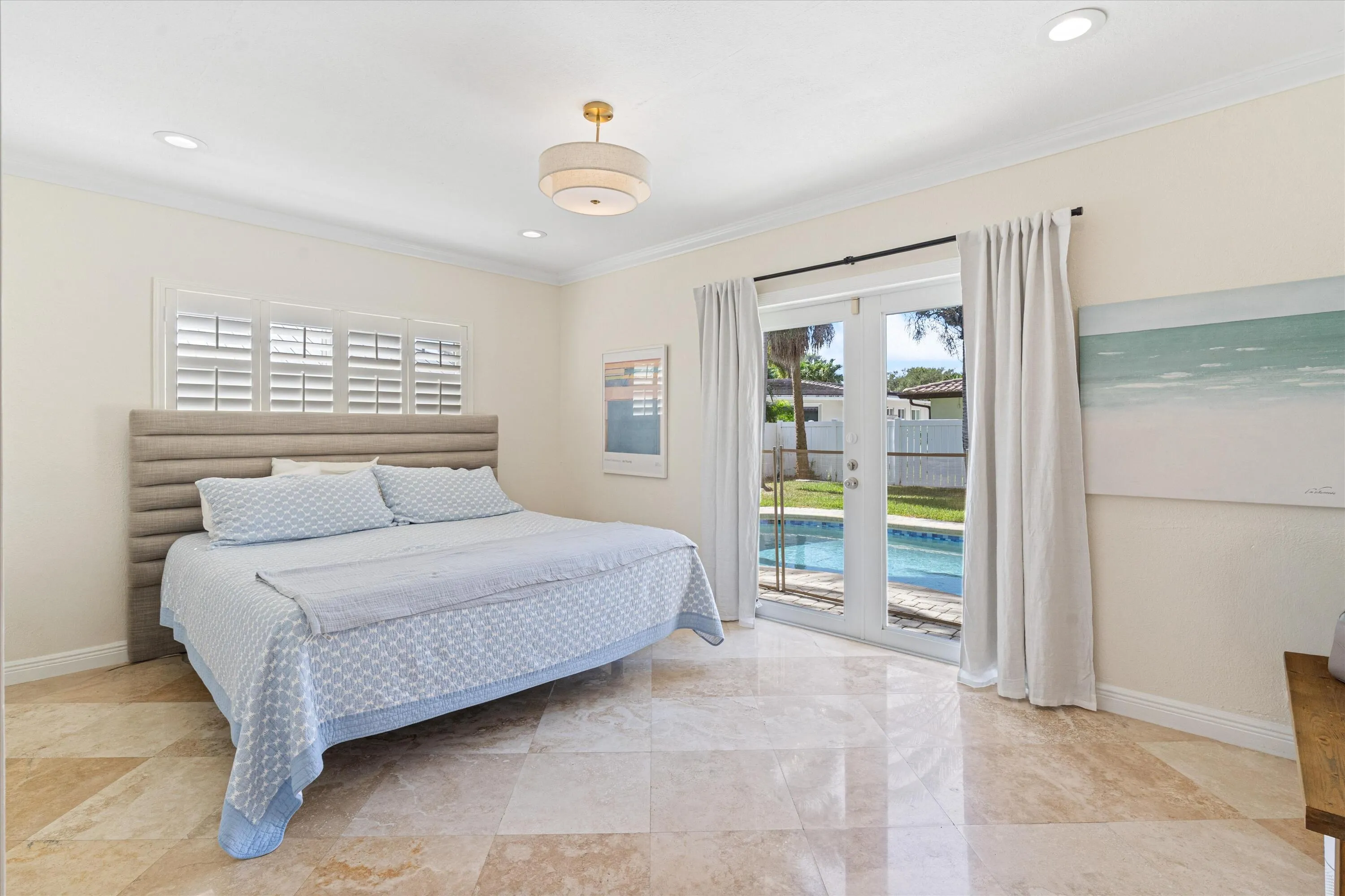 Primary bedroom with pool view