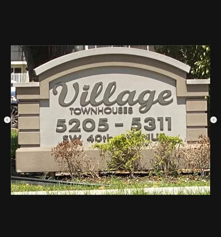 Village Townhouses Welcome Sign
