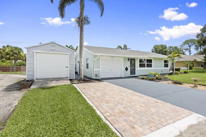 Extended paver brick driveway and additional storage shed.