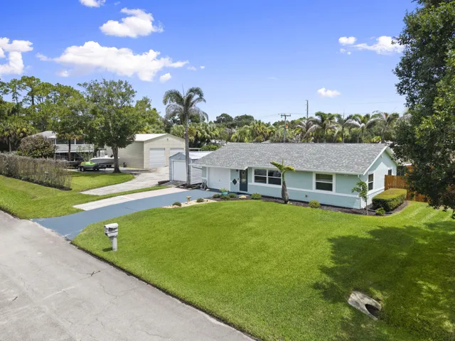 Great curb appeal with landscaped yard and spacious double lot.