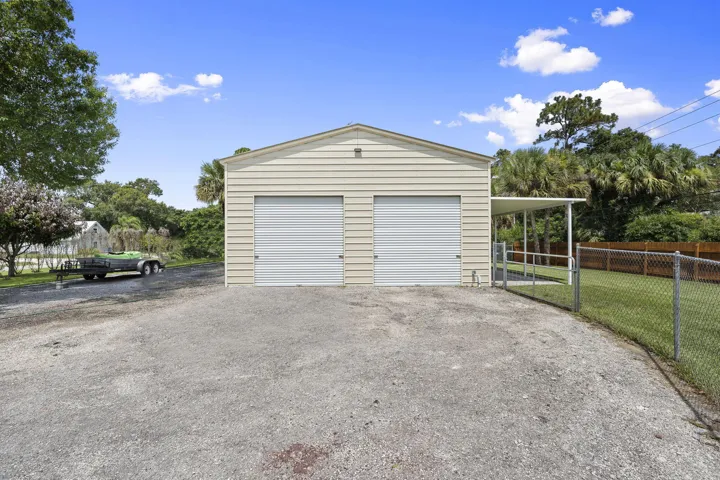 30' x 40' workshop and 10' x 40' covered lean-to. Additional parking areas to the side and front