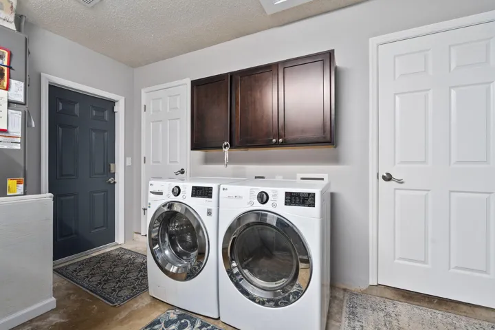 Dedicated laundry area with additional storage cabinets (Washer and dryer do not convey)