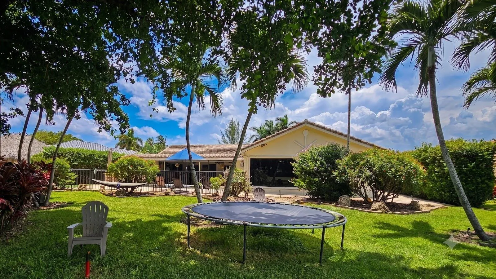 Fenced Backyard Lawn with Mature Shade Trees