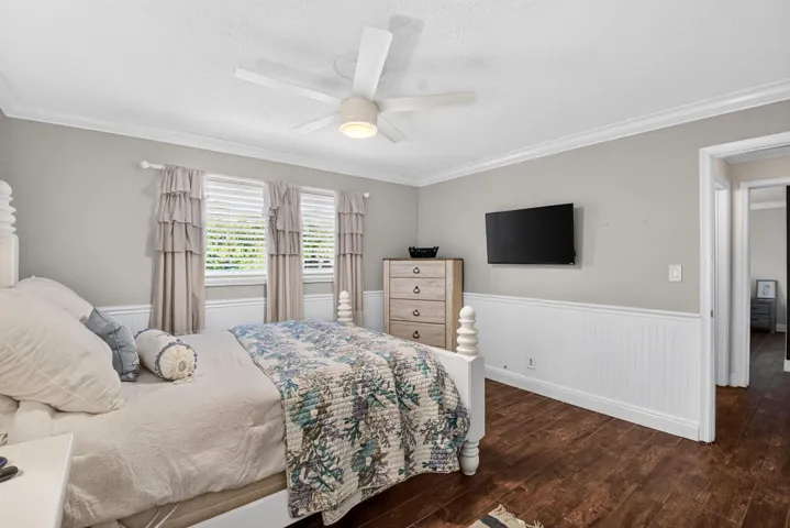 Bedroom with Ceiling Fan, Wainscot & Shutters