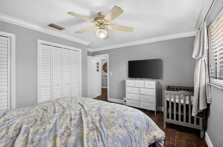 Bedroom with Two Closets, Ceiling Fan & TV Wall