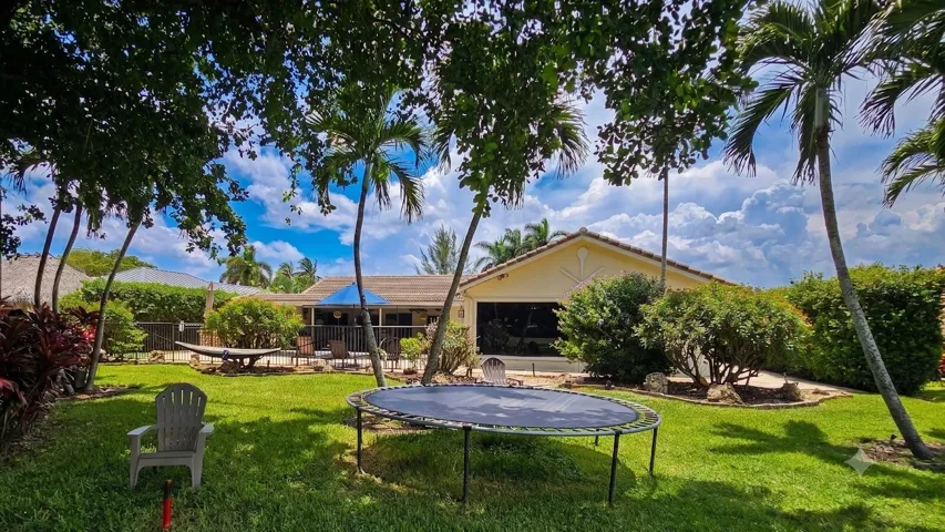 Fenced Backyard Lawn with Mature Shade Trees