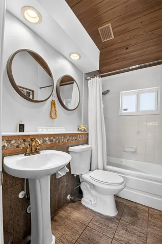 Full Bath with Vaulted Wood Plank Ceiling