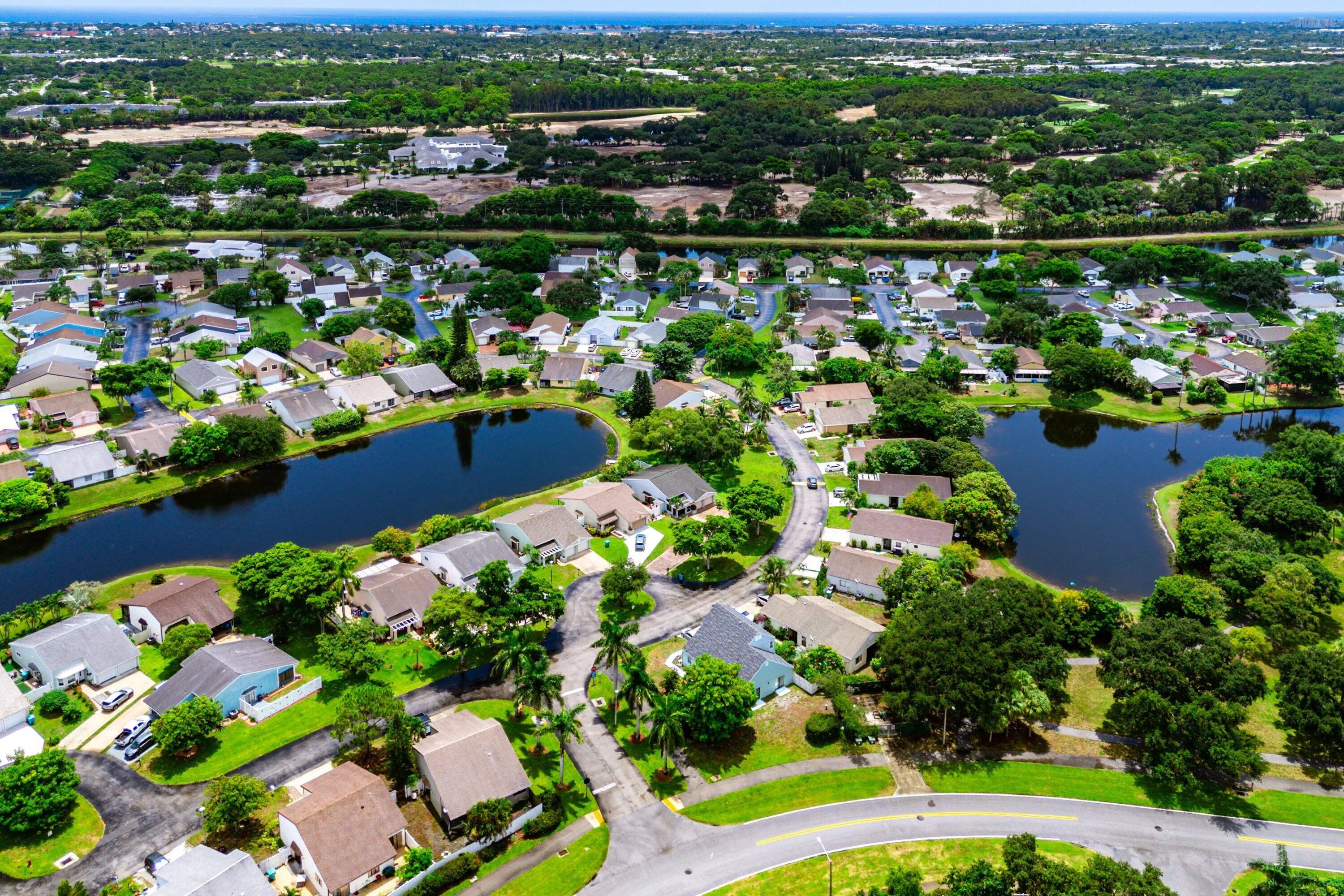 Aerial perspective showcasing a residential community with numerous homes