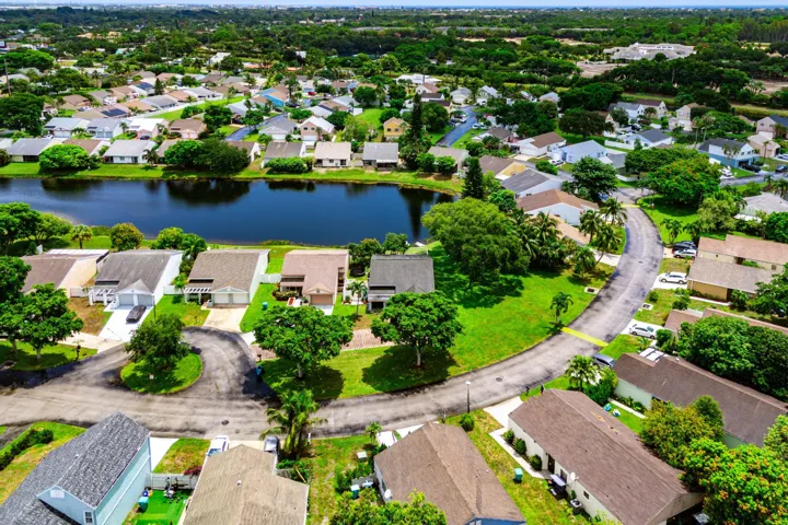 Residential community featuring a prominent central pond