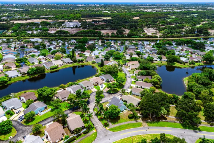Aerial perspective showcasing a residential community with numerous homes