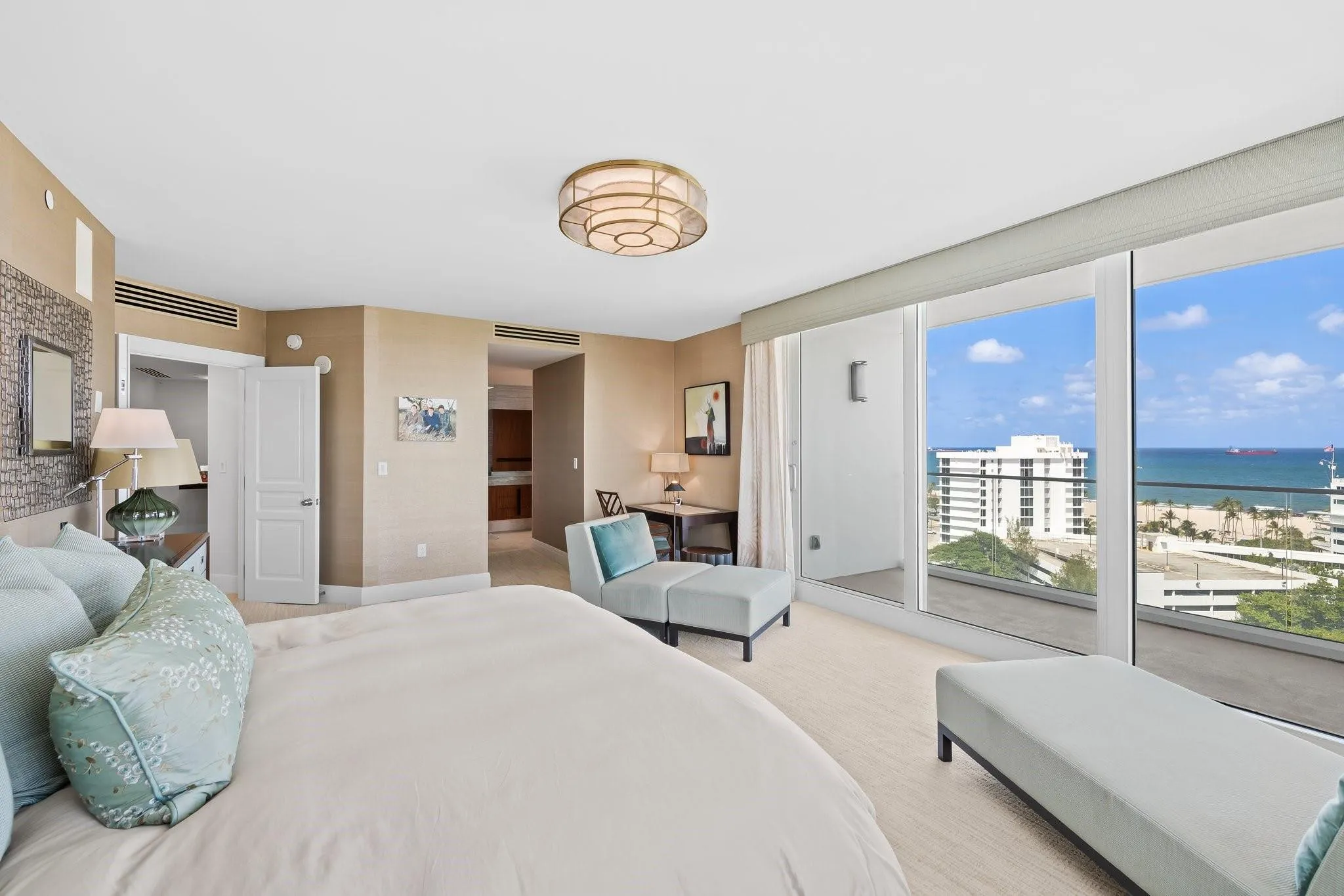 Room featuring full-height sliding glass doors opening to a balcony