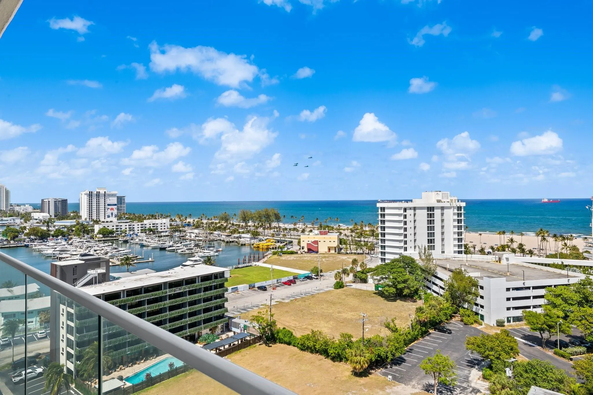 Expansive water and city vistas from a glass-paneled balcony