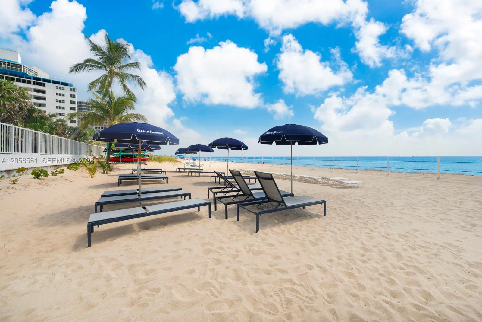 Beach area w chaise and umbrellas