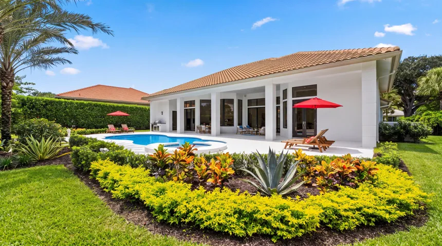 Gorgeous landscaping framing pool area