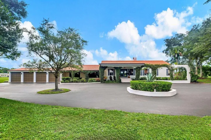circular drive, 4 car garage, main house