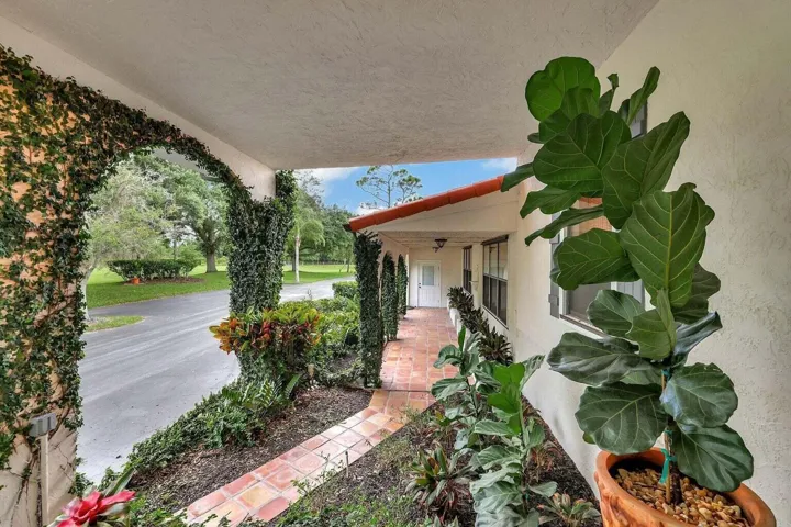 lush greenery, front exterior of home