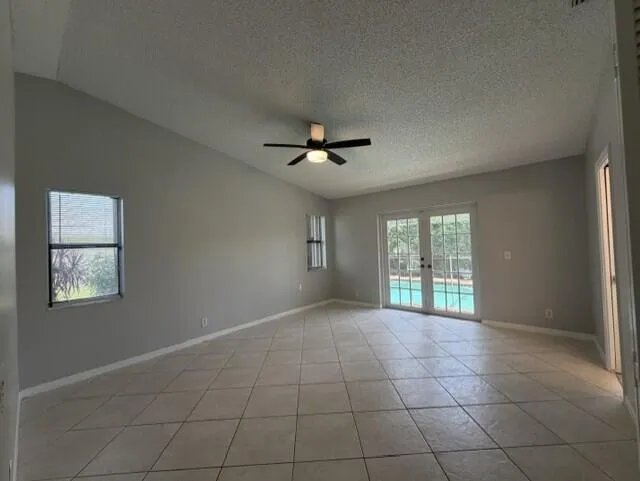 PRIMARY BEDROOM OPENS TO SCREENED POOL
