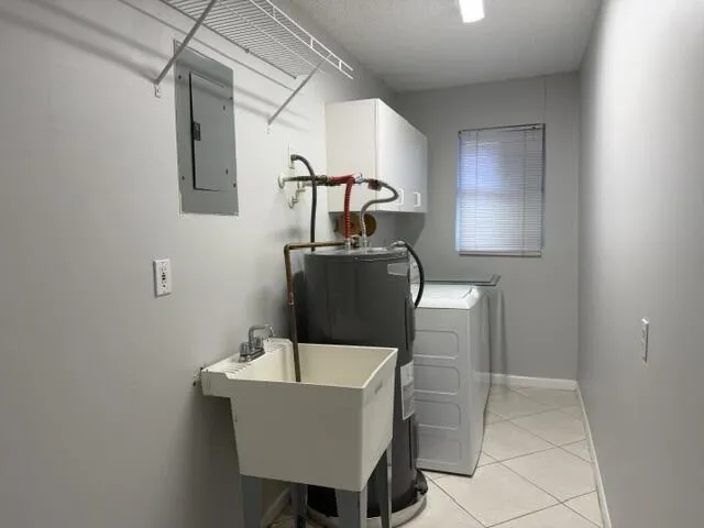 INSIDE LAUNDRY ROOM WITH SINK