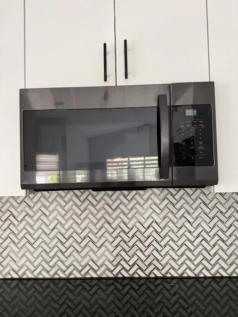 Microwave above the induction stove.