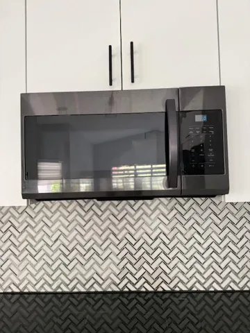 Microwave above the induction stove.