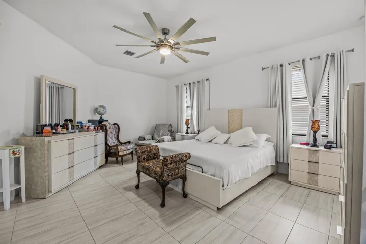A spacious primary retreat with room to unwind, featuring generous proportions, abundant natural light, and a private ensuite designed for everyday comfort.