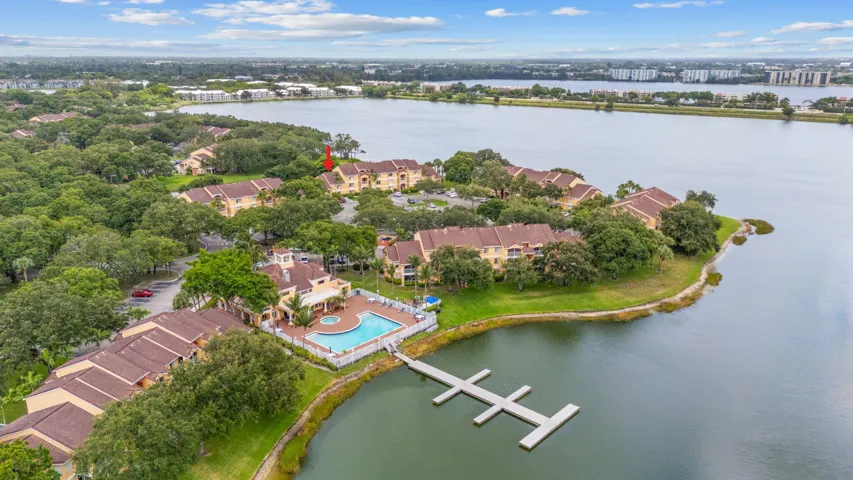 Aerial view highlighting the clubhouse’s location within the community, surrounded by scenic lakes and mature landscaping.