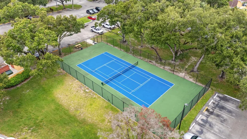 Community tennis court provides a dedicated space for recreation within the neighborhood.