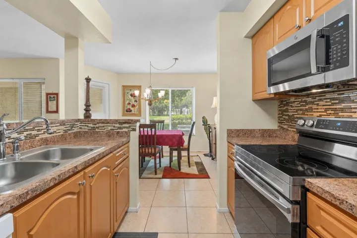 Breakfast bar creates a seamless transition between the kitchen and dining area, making the layout ideal for everyday living and entertaining.