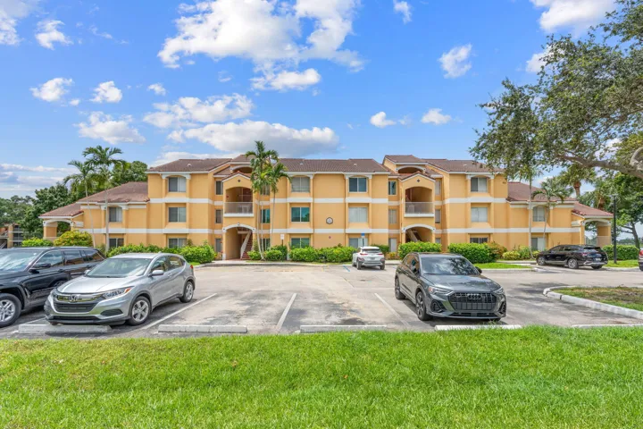 Well-maintained community building with ample resident parking and landscaped grounds.