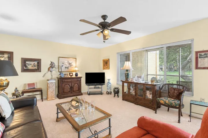 A wall of windows frames peaceful water views while providing plenty of natural light throughout the main living space.