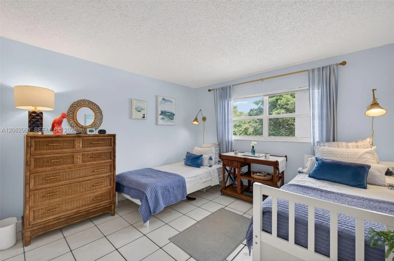 Second bedroom features two twin beds and a walk-in closet.