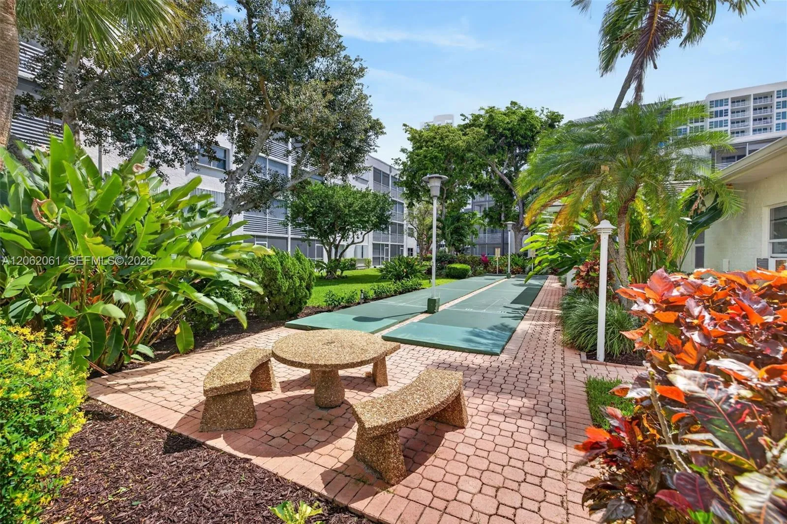 Spend your afternoons enjoying shuffleboard in a relaxed, tropical garden setting.