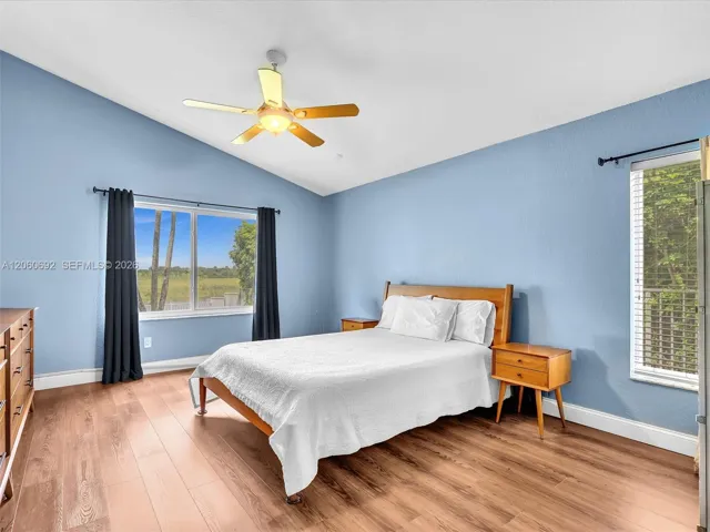 Primary bedroom with views out to the lake and preserve!