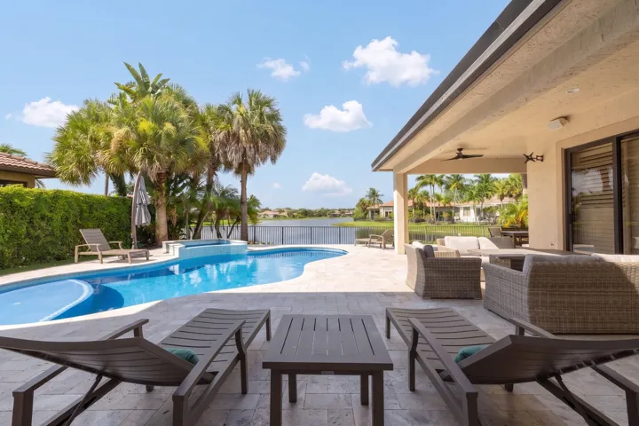 Expansive wide lake views from living room, family room and first floor primary suite.