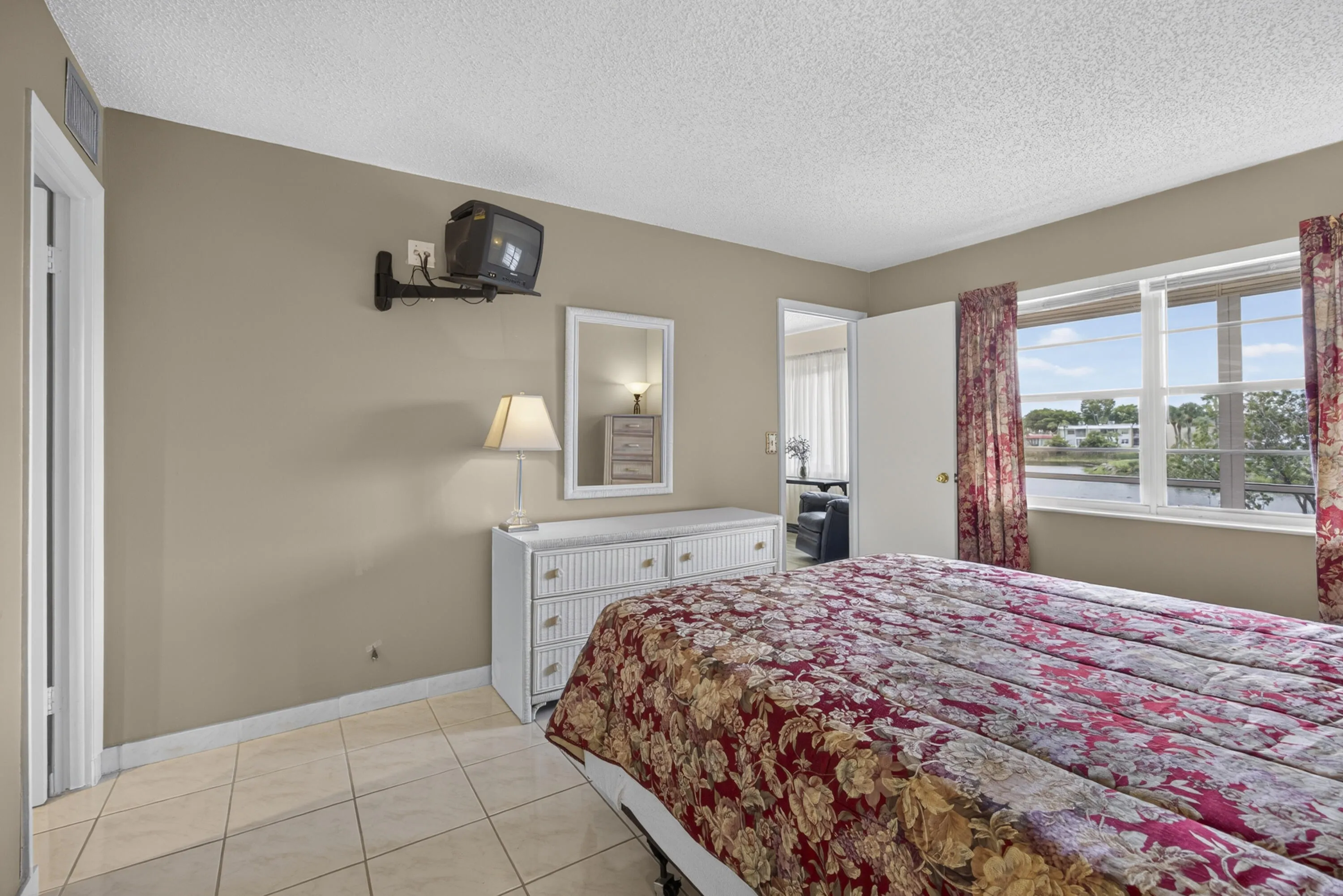 Beige wall tones throughout with tile flooring