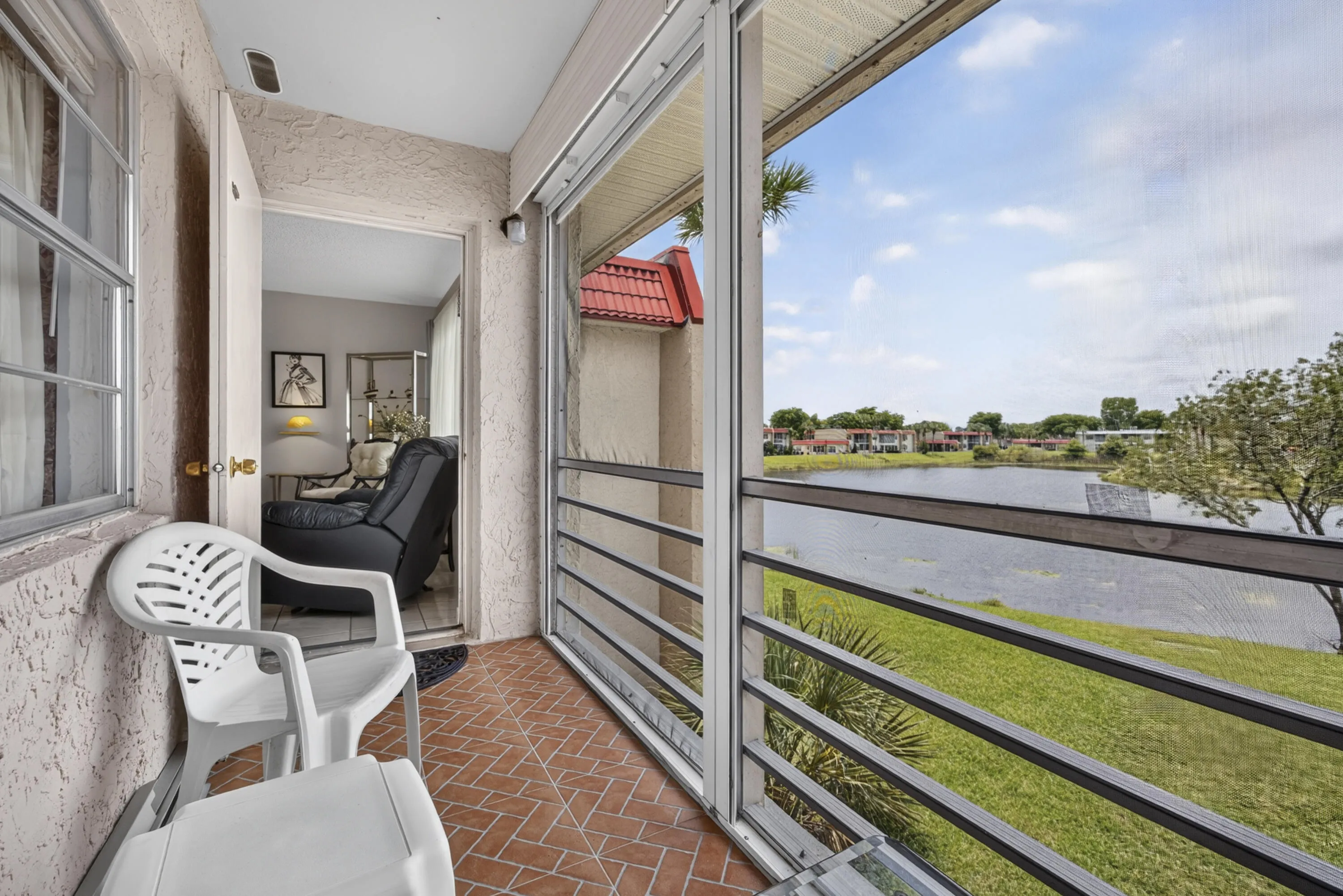 Screened patio with terracotta tile flooring