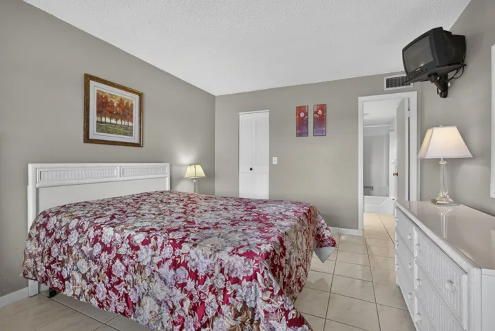 Neutral-toned walls complement the white ceiling and tile flooring