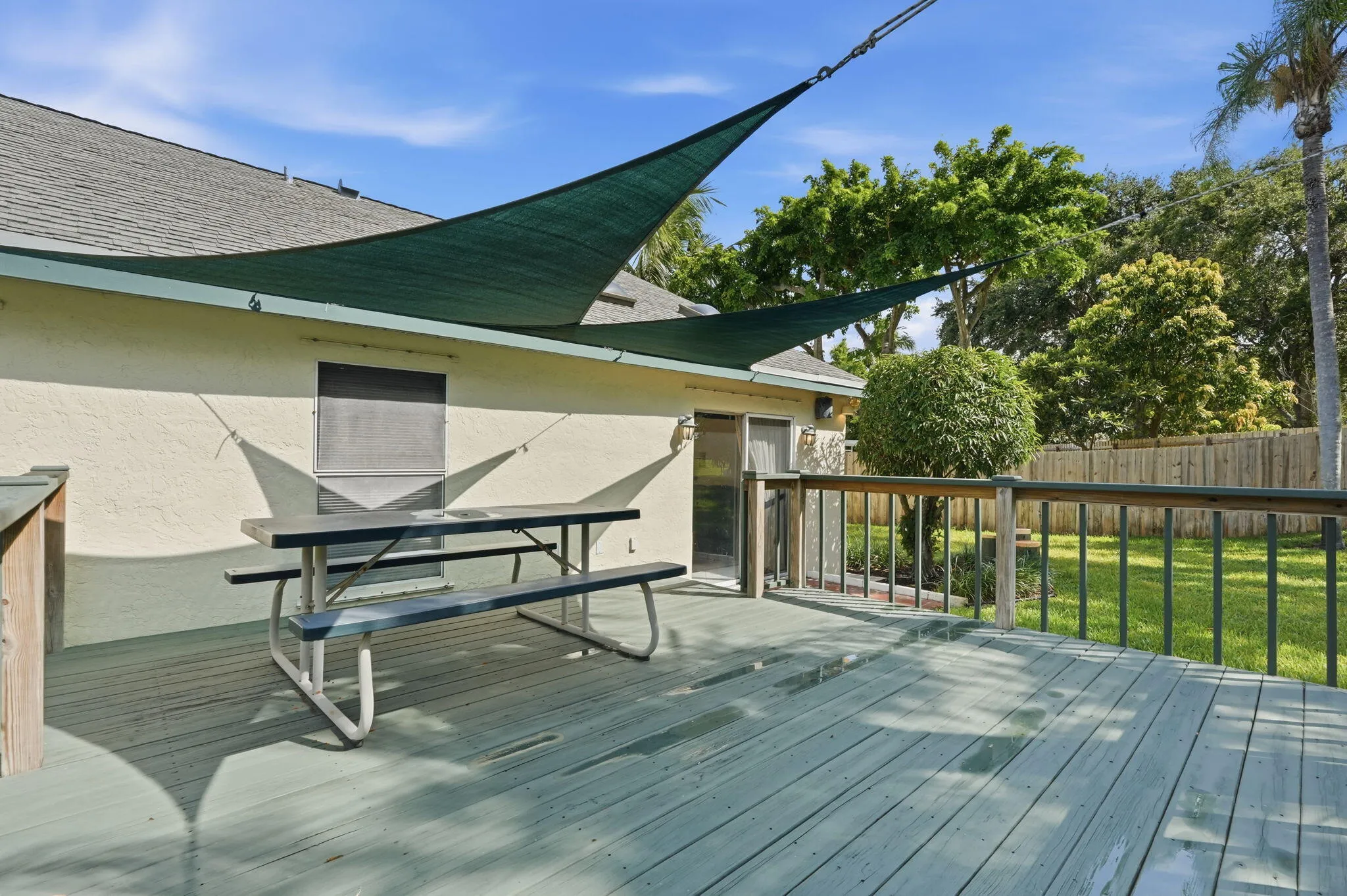 Expansive outdoor deck featuring wood flooring and a perimeter railing