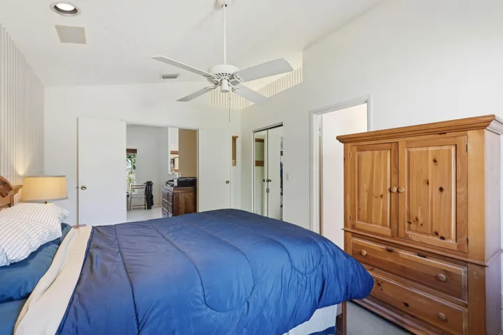 Vaulted white ceilings featuring a ceiling fan and recessed lighting