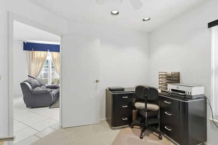 Neutral wall paint with recessed ceiling lighting, a ceiling fan, and carpet flooring