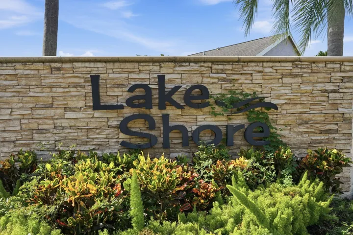 Lake Shore community entrance sign featuring stacked stone construction and dimensional lettering