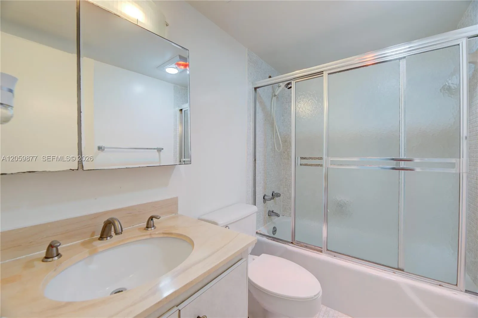 private master bathroom with tub and shower
