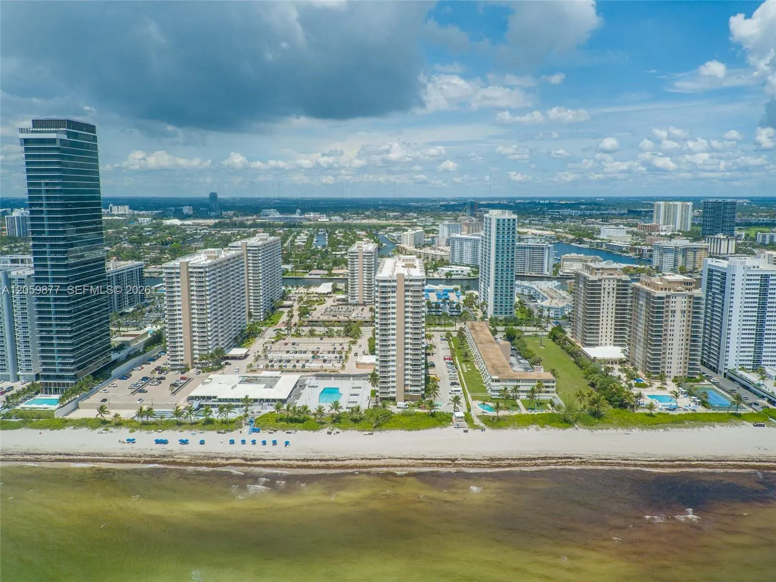 YOUR BUILDING IS OCEAN SIDE SOUTH TO THE RIGHT ..(behind the beach chairs)