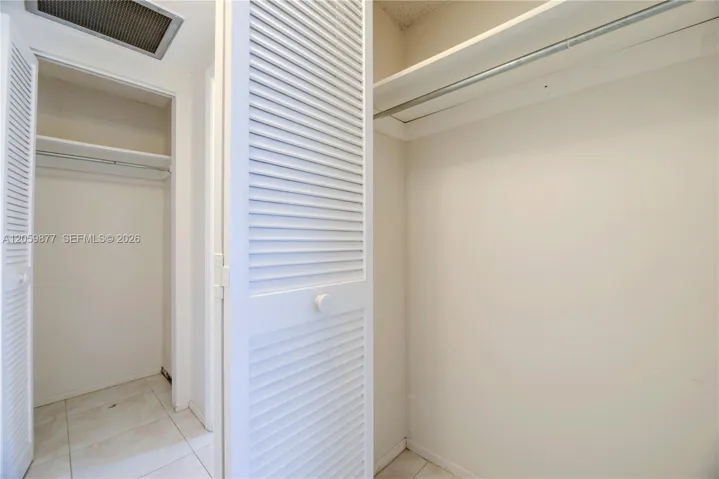 2 closets in foyer area of the bedroom
