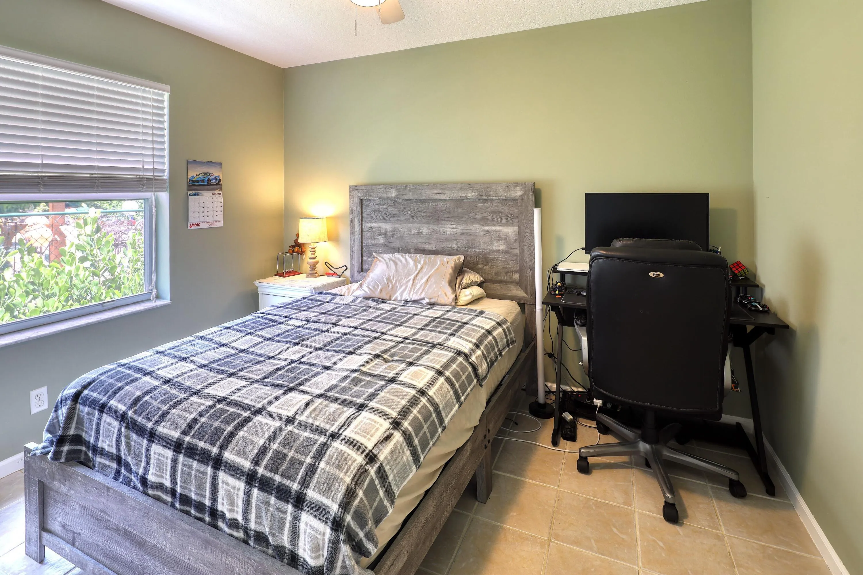 Comfortable fourth bedroom offering flexibility for guests, a home office, or hobby room.