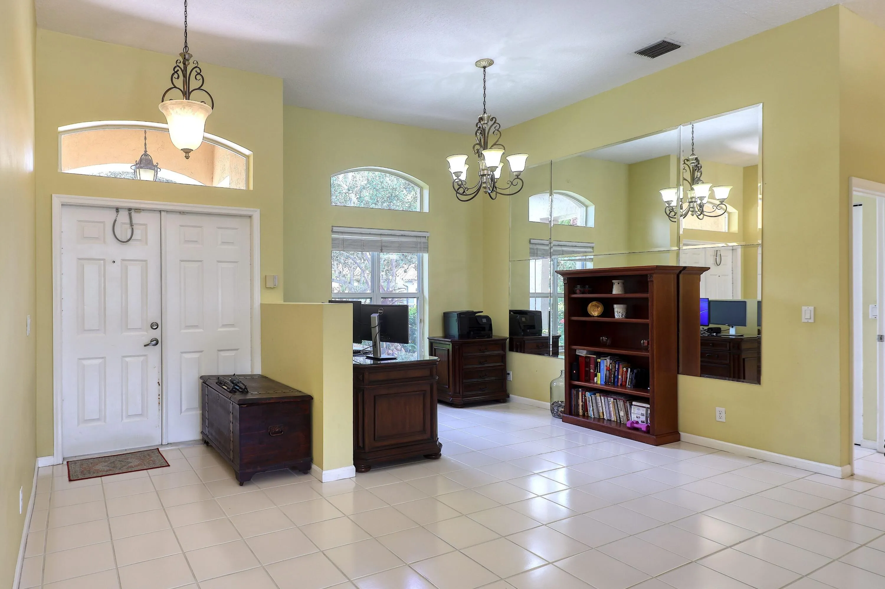 Welcoming foyer with soaring ceilings and an open layout that creates a bright first impression from the moment you enter.